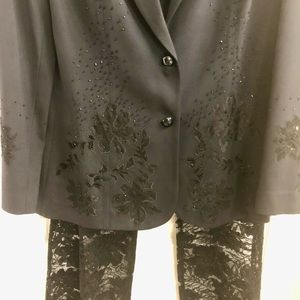 A Woman’s jet black tuxedo